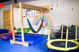 indoor playground, trampoline, hammock, painting, blocks